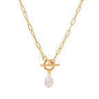 Gold necklace with a pearl pendant on a white background