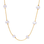 Pearl necklace with gold chain on a white background