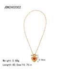 Gold necklace with a heart-shaped pendant on a white background