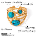 Gold ring with turquoise stones and measurement details on a white background