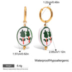 Pair of earrings with green and red design on white background, showing measurements and product details.