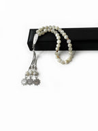 Side angle of the 8mm moonstone beads, strung in a traditional Emirati style tasbih
