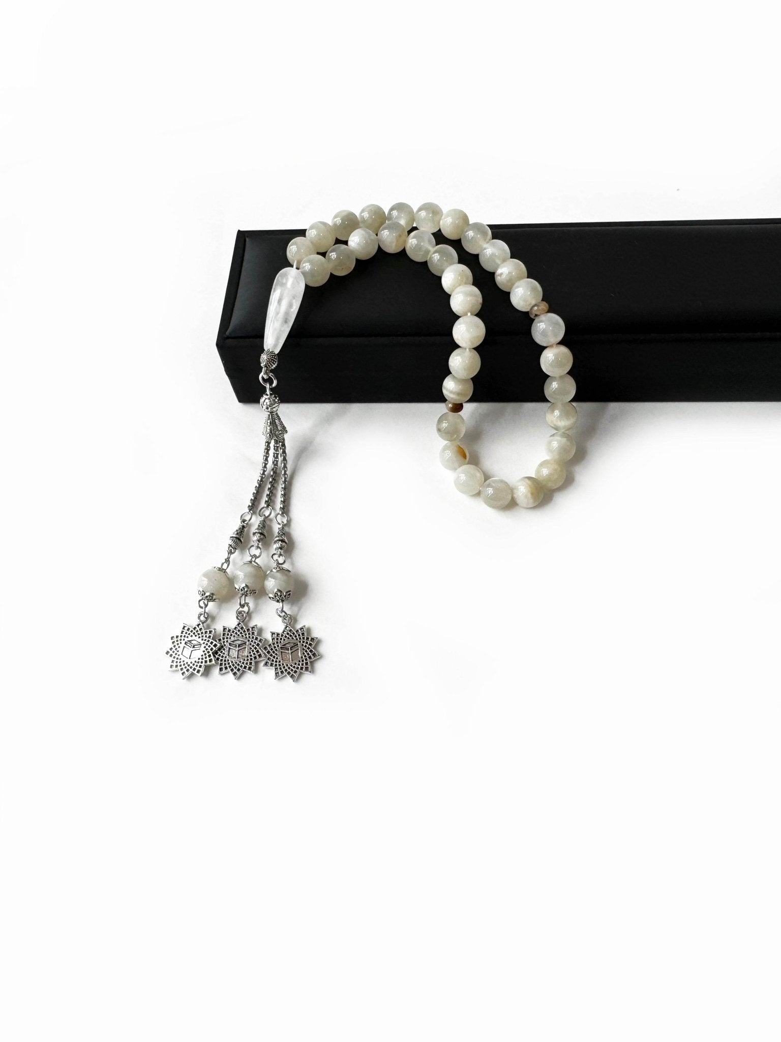 Side angle of the 8mm moonstone beads, strung in a traditional Emirati style tasbih