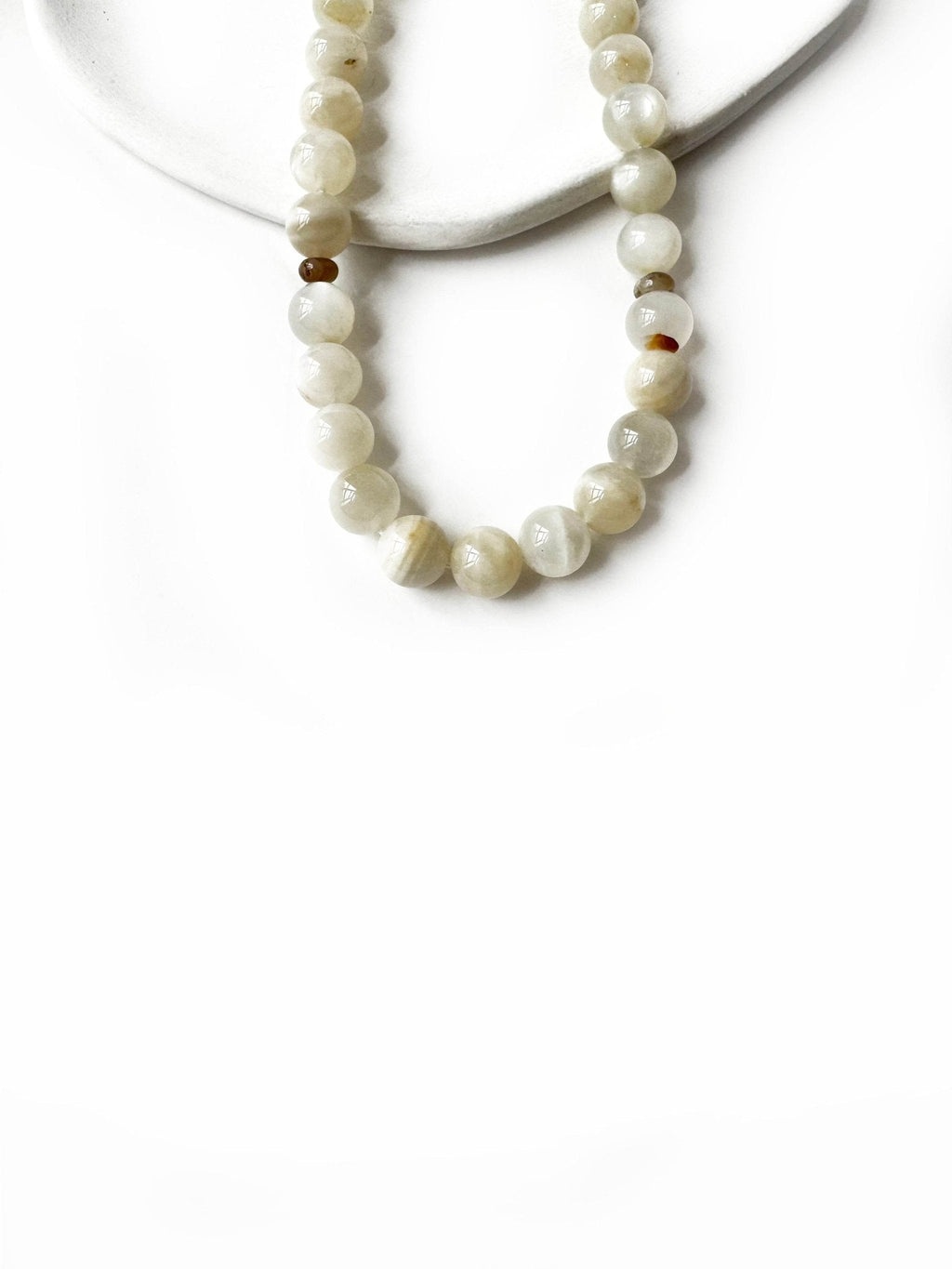 Elegant, hand-assembled moonstone tasbih demonstrating meticulous craftsmanship