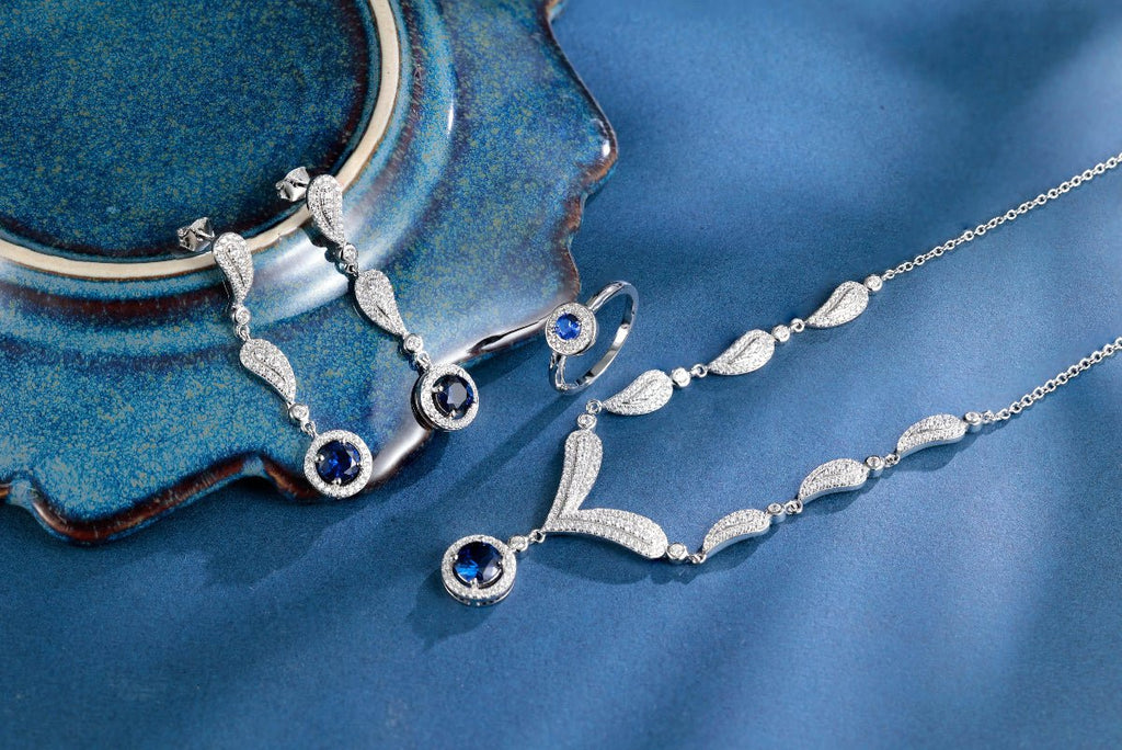 Blue gemstone necklace crafted in rhodium-plated sterling silver with sparkling accents