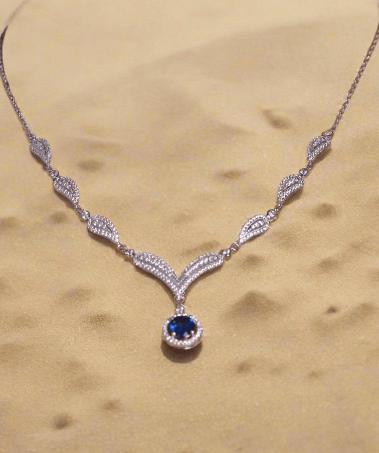 Detailed image of women’s luxury necklace featuring oval-cut blue zirconia stone