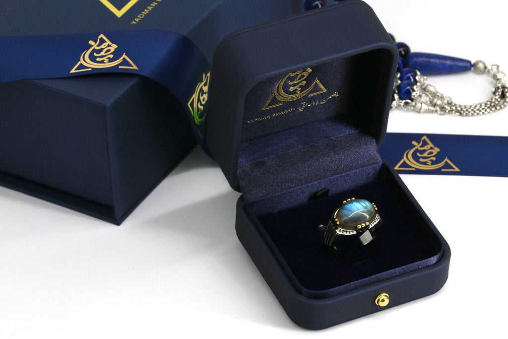 Top view of labradorite gemstone showing iridescent color shift in silver setting