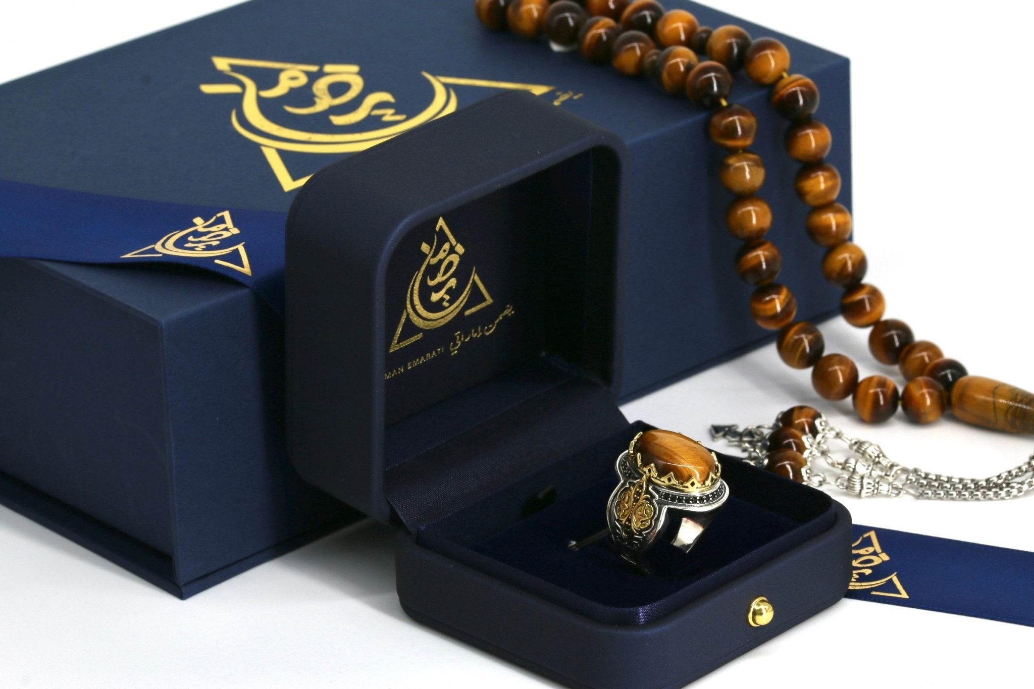 Close-up of tiger eye gemstone with golden bands in polished silver ring