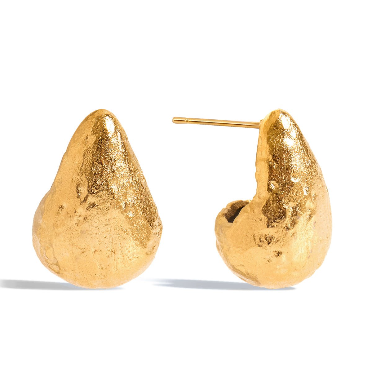 Gold earrings with a textured design on a white background