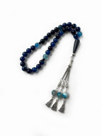 Detailed view of blue agate tasbih showing shine and traditional Emirati craftsmanship