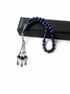 Side view of handcrafted tasbih featuring polished blue tiger eye stones