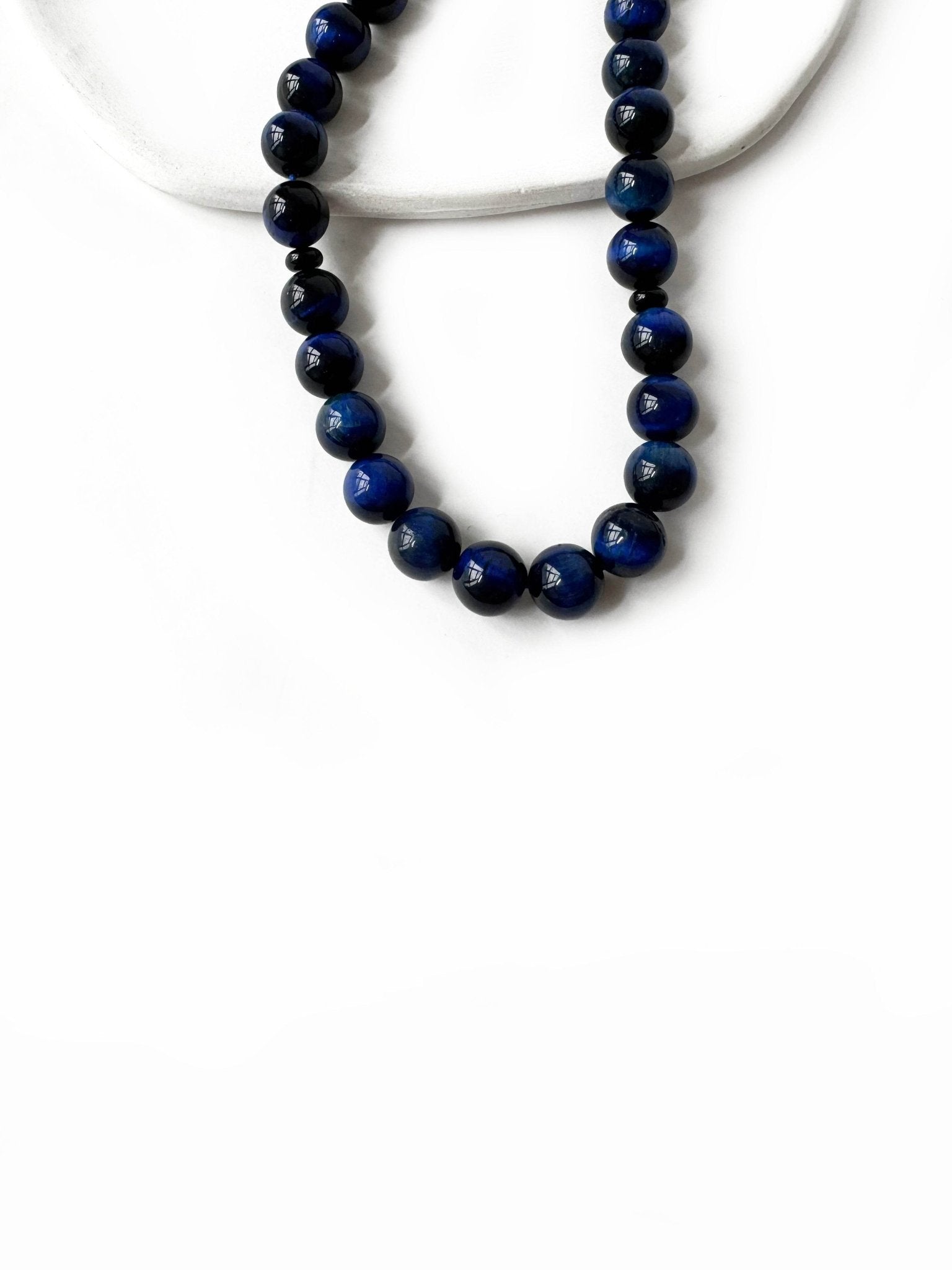 Detailed view of blue tiger eye Islamic prayer beads – calming and elegant