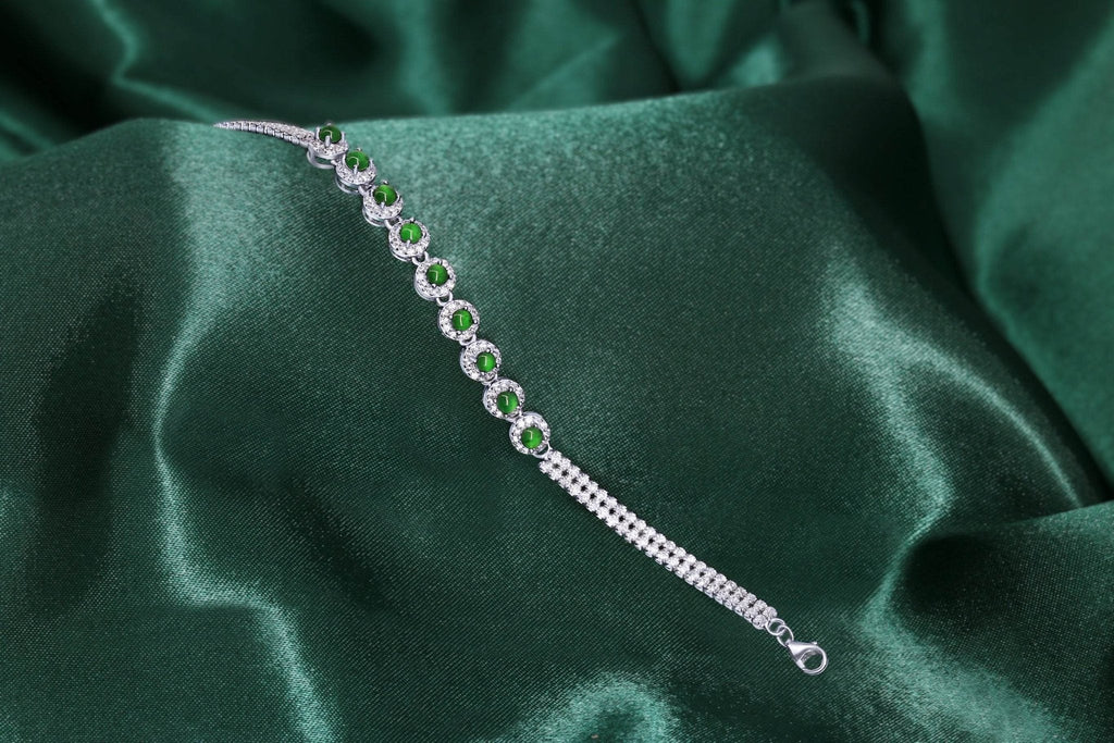 Close-up of green jade beads and sparkling zirconia on platinum-plated bracelet