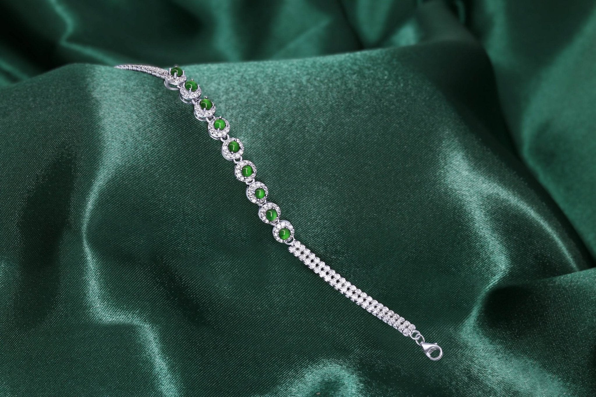 Close-up of green jade beads and sparkling zirconia on platinum-plated bracelet