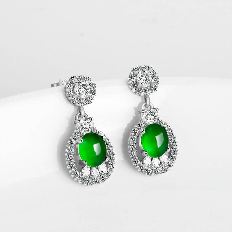 Green jade cabochon earrings surrounded by zirconia stones