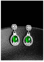 Close-up of luxury jade earrings in platinum silver setting