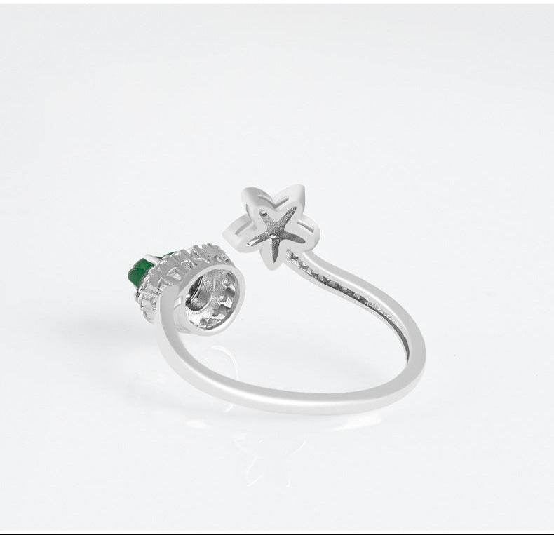 Delicate jade and zirconia ring with open flower detail