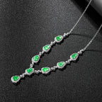 Close-up of green jade stones set in platinum-plated silver necklace