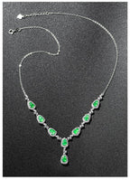 Minimalist jade necklace featuring green teardrop gemstones for women