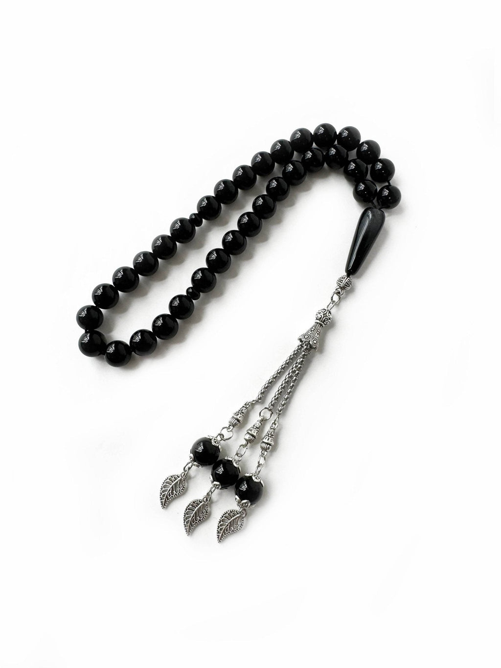 Close-up of 10mm onyx prayer beads in traditional misbaha form