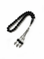 Close-up of 10mm onyx prayer beads in traditional misbaha form