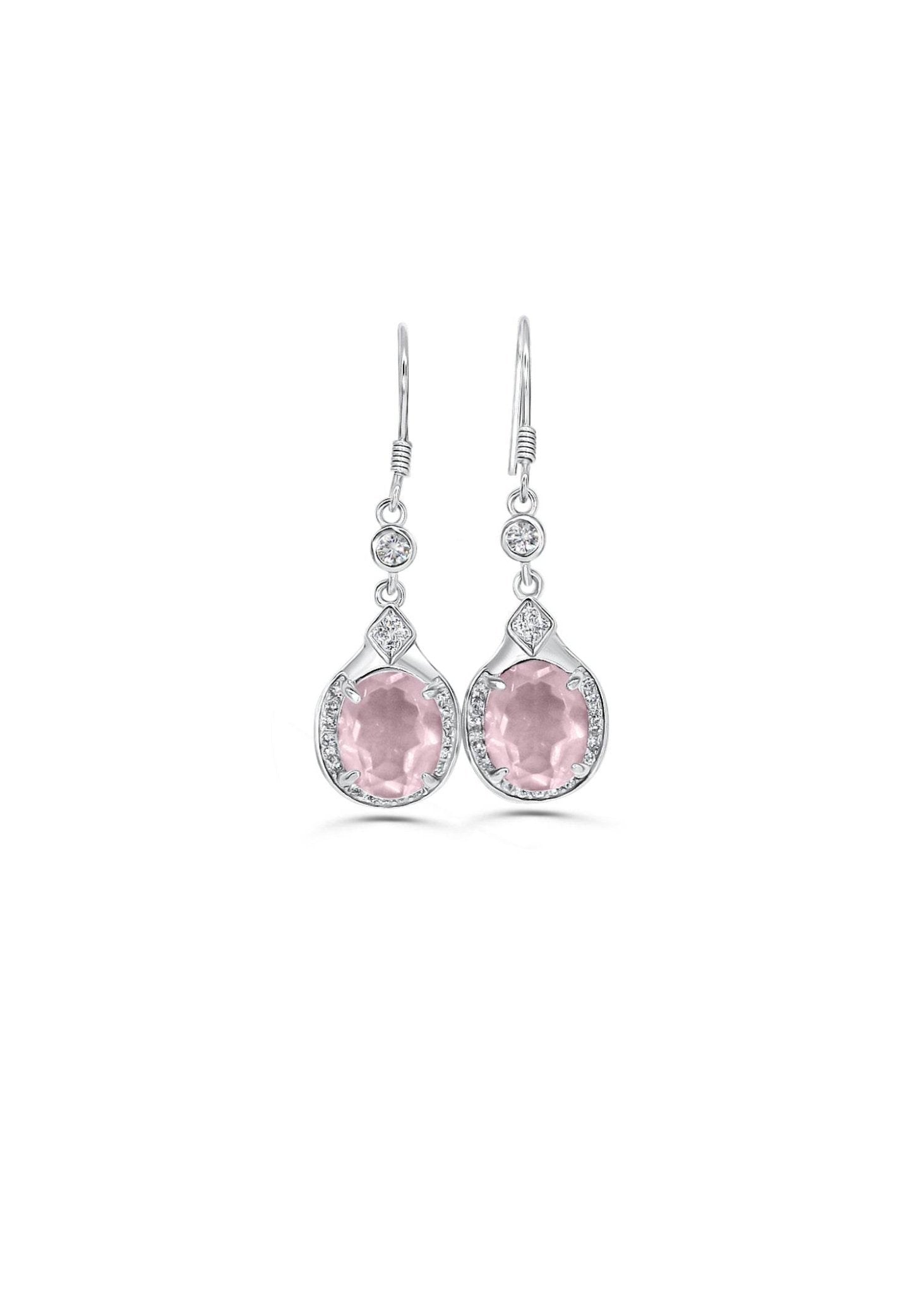 Close-up of soft pink crystal earrings in silver setting