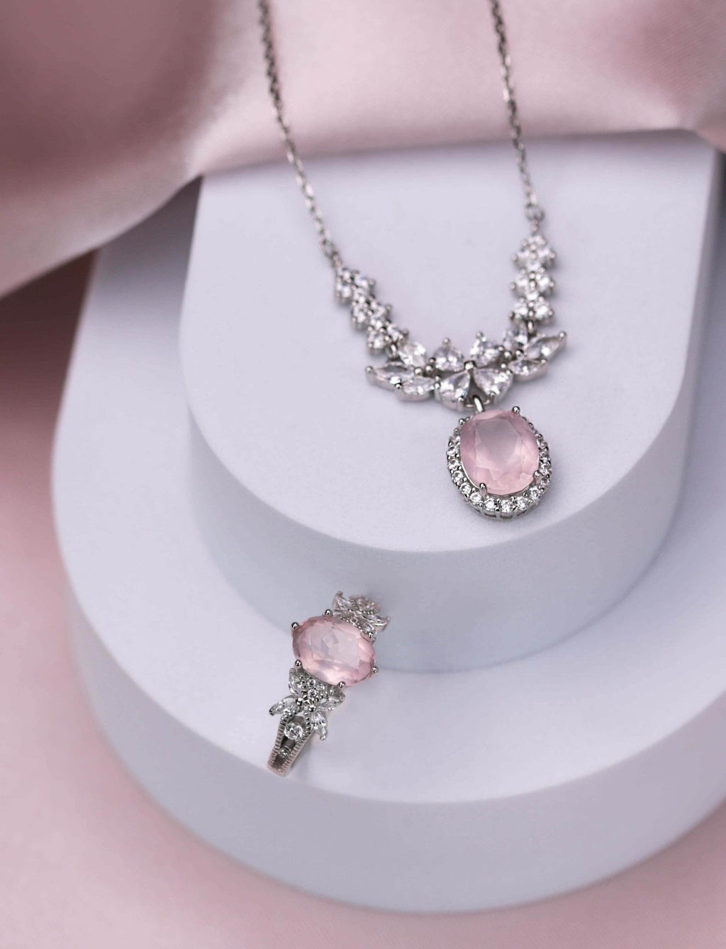 Rhodium-plated necklace and ring set featuring natural rose quartz and white zirconia, elegant