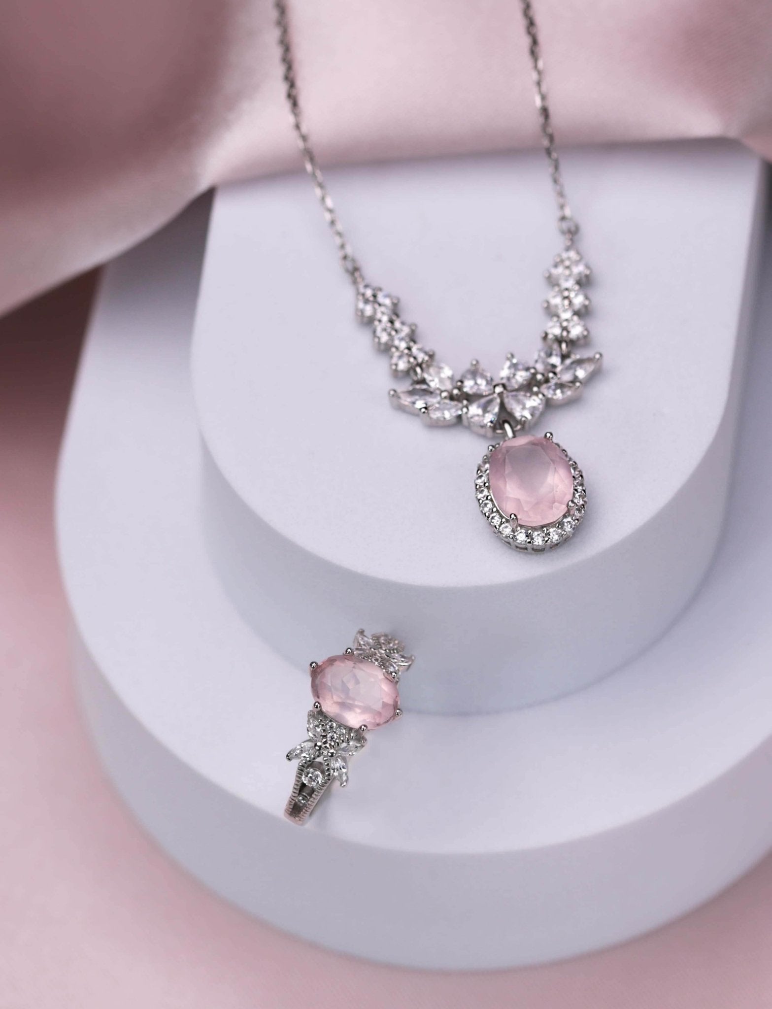 Rhodium-plated necklace and ring set featuring natural rose quartz and white zirconia, elegant
