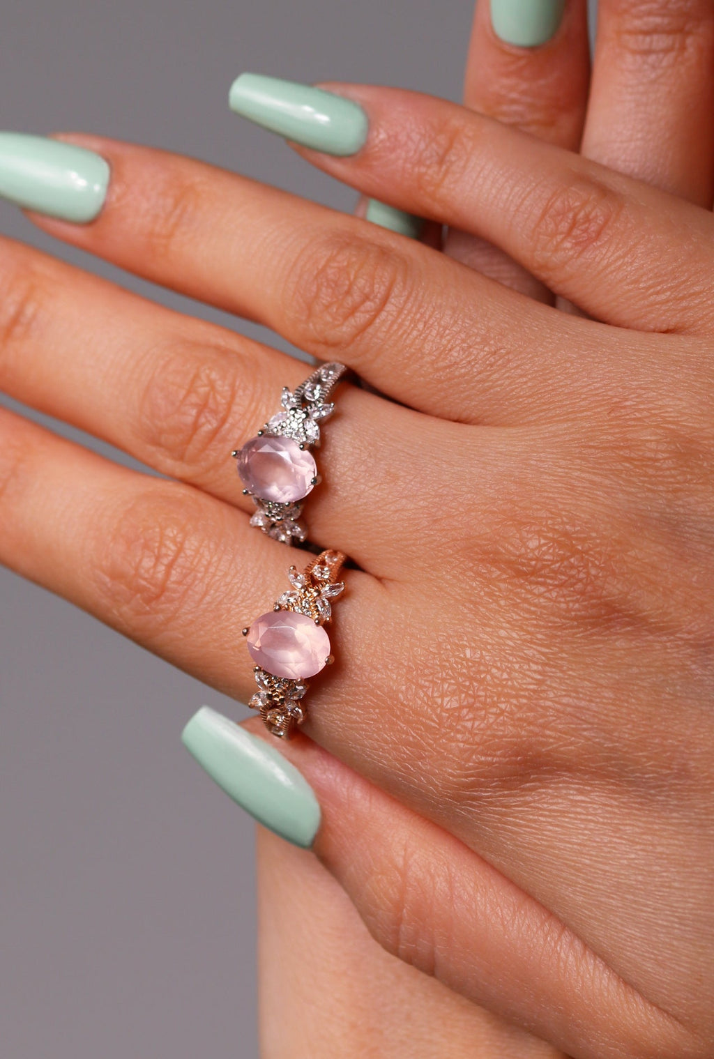 Close-up of soft pink crystal ring in platinum setting