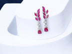 Floral drop earrings with red ruby gemstones and silver finish