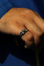 Modern celestial-inspired men’s ring with natural star sapphire