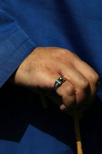 Close-up of natural star sapphire men's ring in gold-plated silver