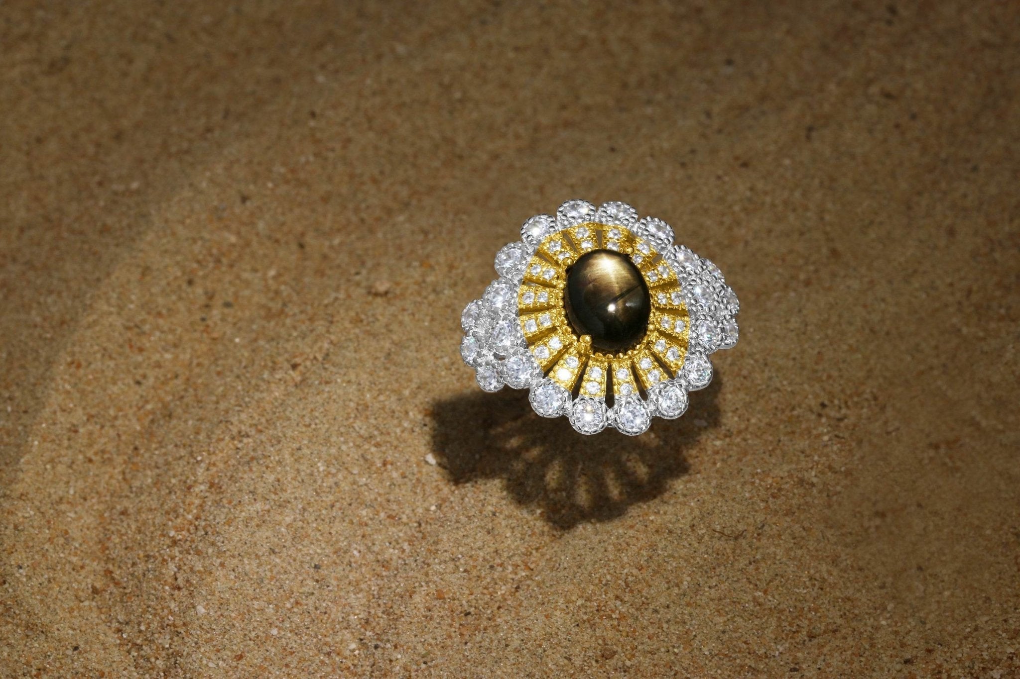 Elegant star sapphire ring with gold and zirconia accents