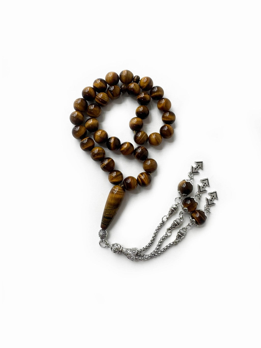 Close-up of tiger eye prayer beads in warm brown tones