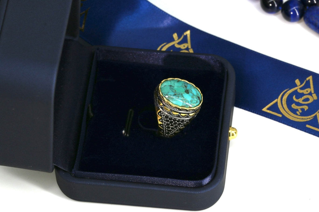 Statement men's ring with natural turquoise and gold-tone details