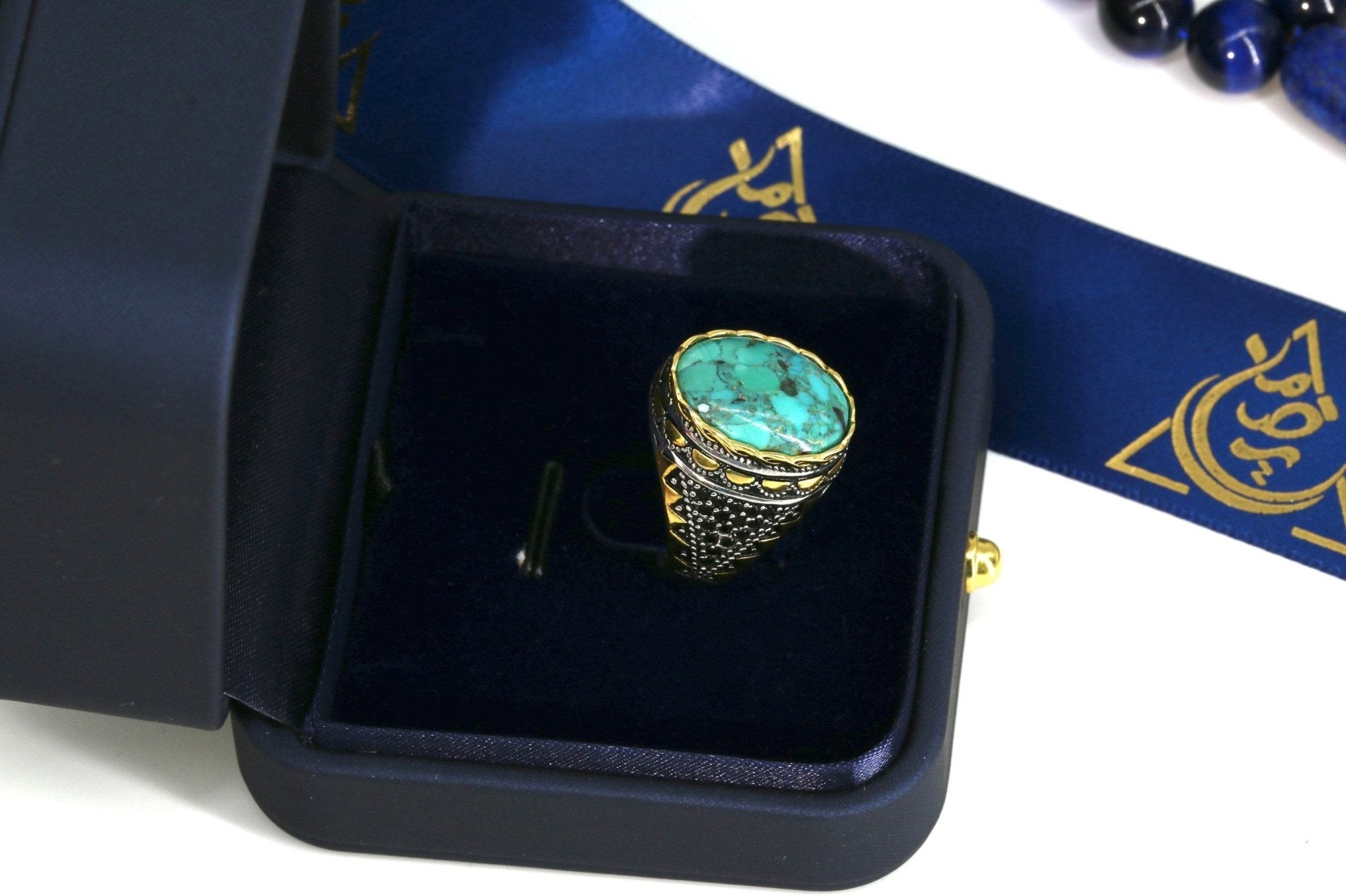 Statement men's ring with natural turquoise and gold-tone details