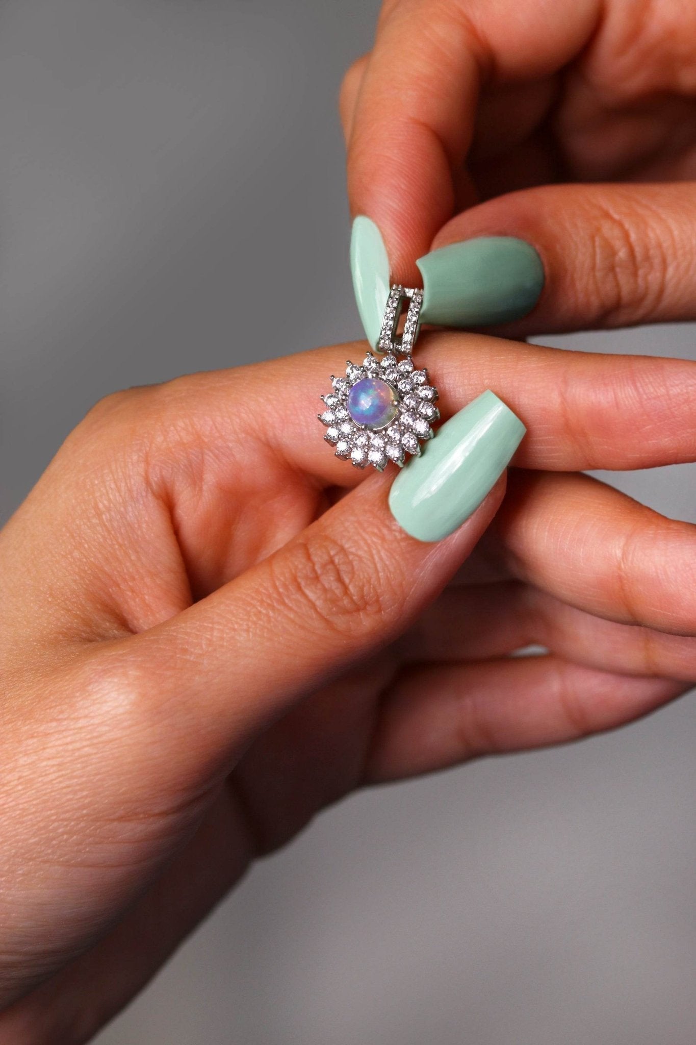 She is Opalin pendant with opal gemstone