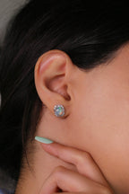 Oval opal earrings with zirconia halo design
