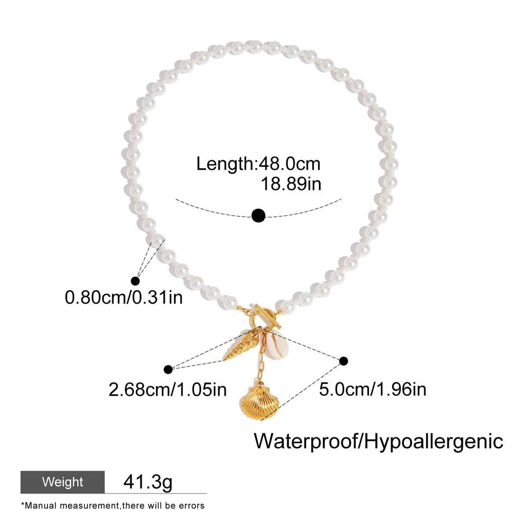 Pearl bracelet with gold charm and measurement details on a white background