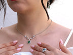 Elegant women’s necklace featuring green zirconia stone in halo setting