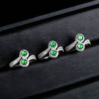 Feminine ring with green jade center and zirconia accents