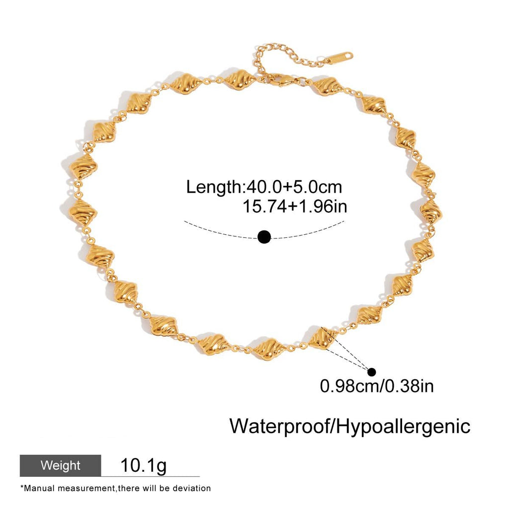 Gold bracelet with measurement details on a white background