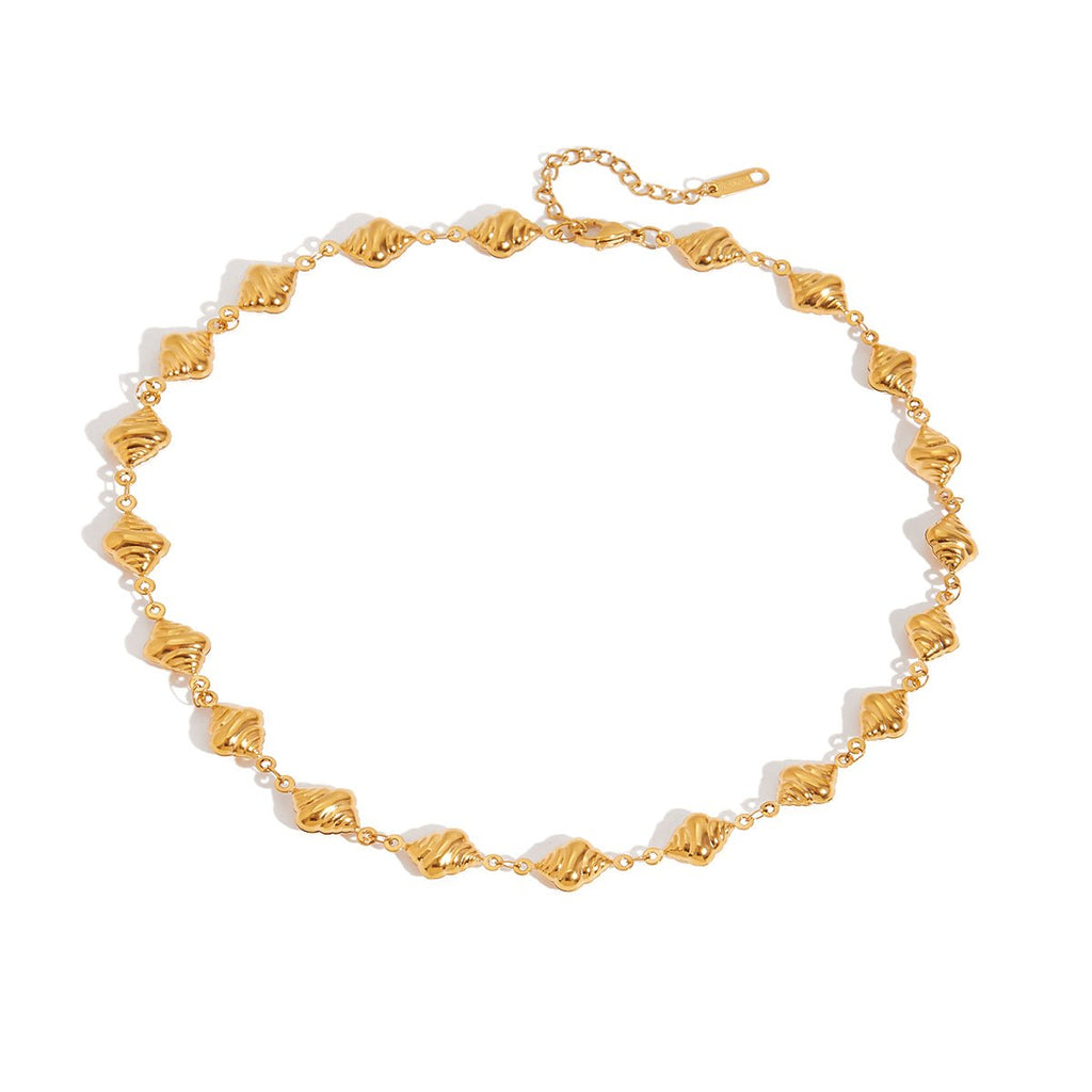 Gold anklet on a white background