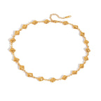 Gold anklet on a white background