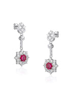 Rhodium-plated silver earrings with ruby-cut red zirconia center