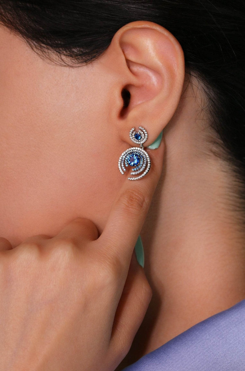 Elegant handmade earrings with sapphire-colored zirconia