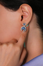 Elegant handmade earrings with sapphire-colored zirconia