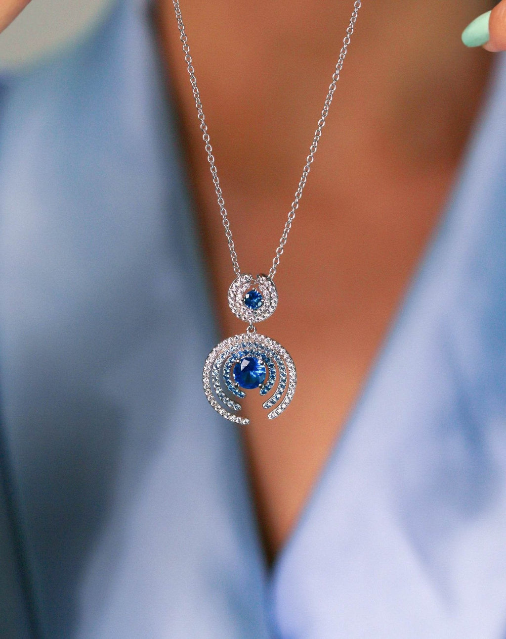 Concentric pendant necklace with blue stones