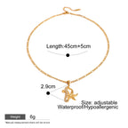 Gold necklace with pendant on a white background, showing measurements and product details.