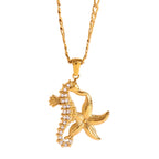 Gold seahorse and starfish pendant on a chain against a white background